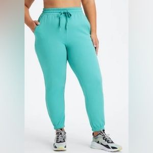 Eco Go-To Classic Sweatpant size medium. Dark Cyan/oat lettering. Like new!